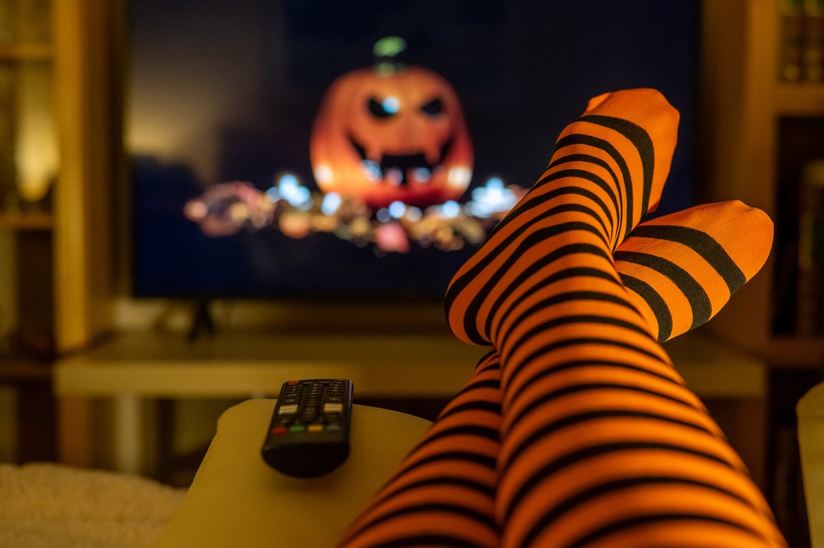 Cozy home living room with a television screen blurred in the background during an evening in